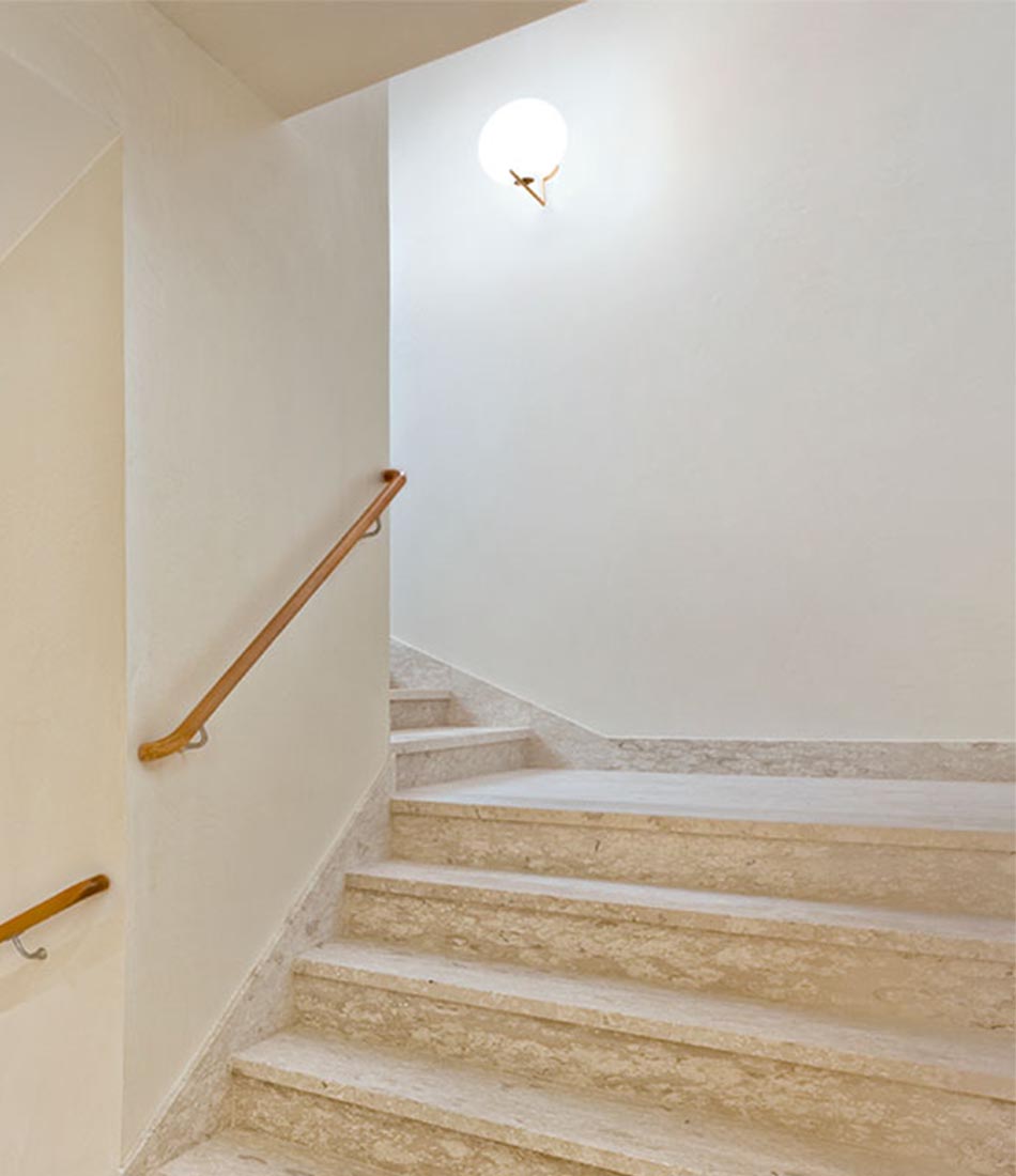 Flos IC Lights Ceiling/Wall Sconce mounted in a stairwell.