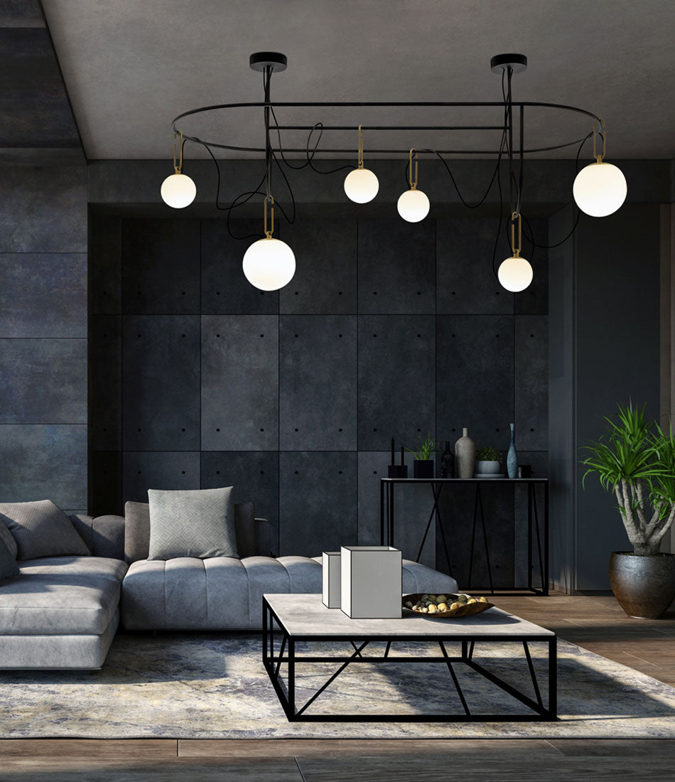 Artemide NH S5 Elliptic suspension lamp mounted to a ceiling above a living room.