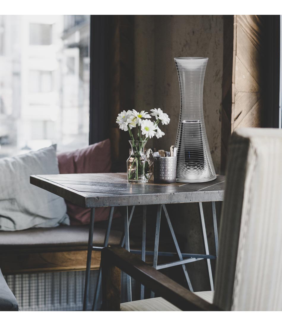 Artemide Come Together table lamp on a small table in a cafe.