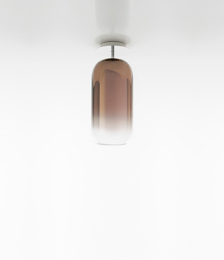Artemide Gople Mini ceiling lamp, with pill-shaped blown glass shade in gradient bronze.