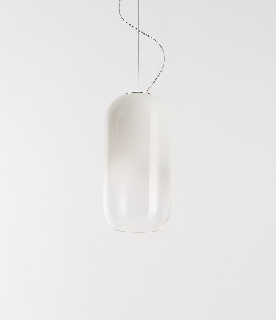Pill-shaped Artemide Gople suspension lamp, with blown glass shade in gradient white.