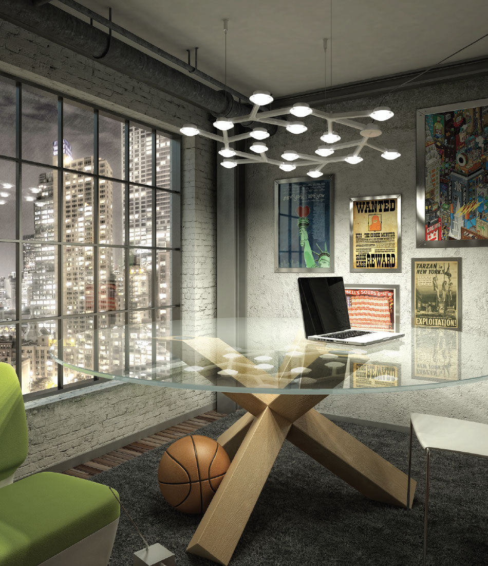 Artemide Led Net Circle suspension lamp above circular glass table in a city apartment.