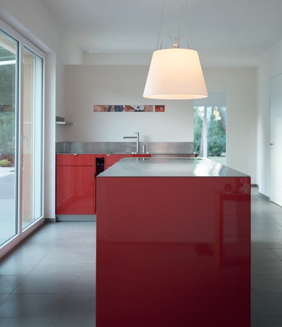 Artemide Tolomeo Mega suspension lamp hangs above a kitchen island.
