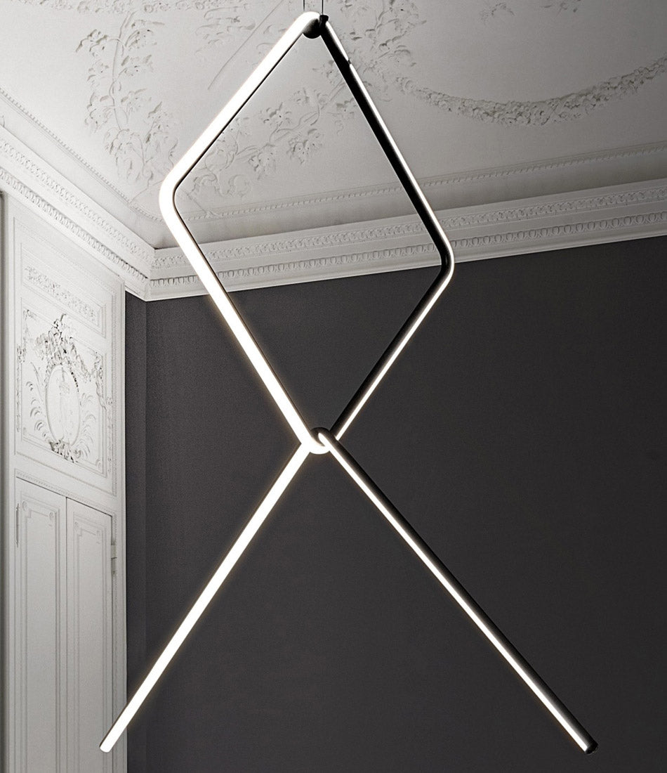 Flos Arrangements Pendant Light 4 hanging from an engraved ceiling.