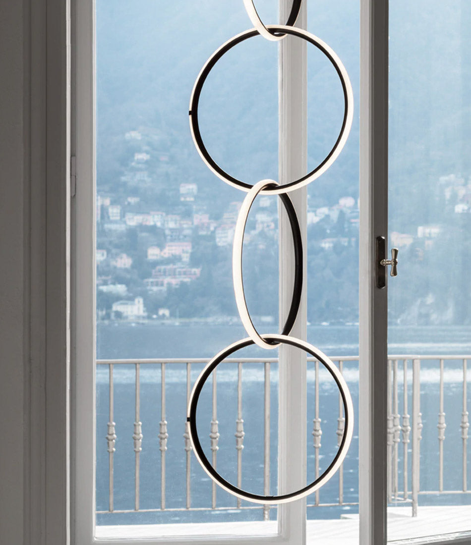 Flos Arrangements Pendant Light 6 hanging in front of an open doorway.