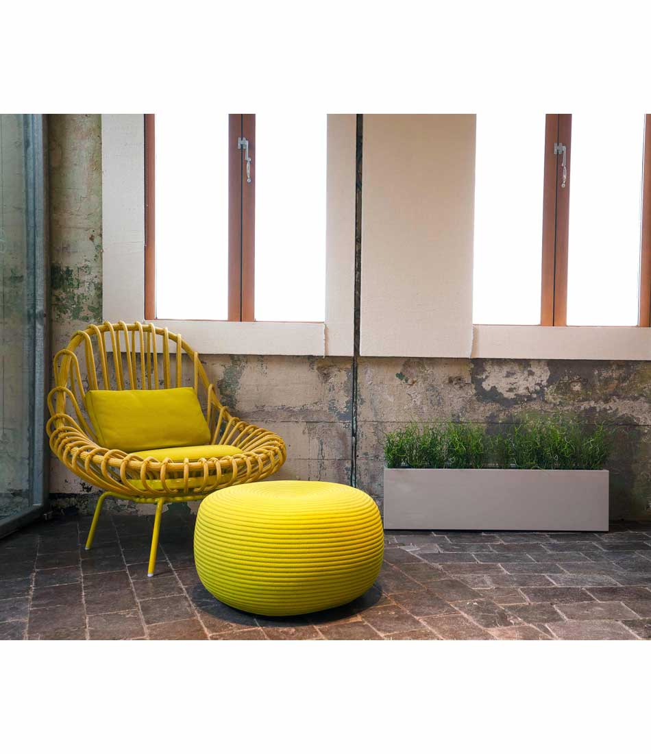 Layer All Day planter in dolphin grey finish next to a chair and ottoman.