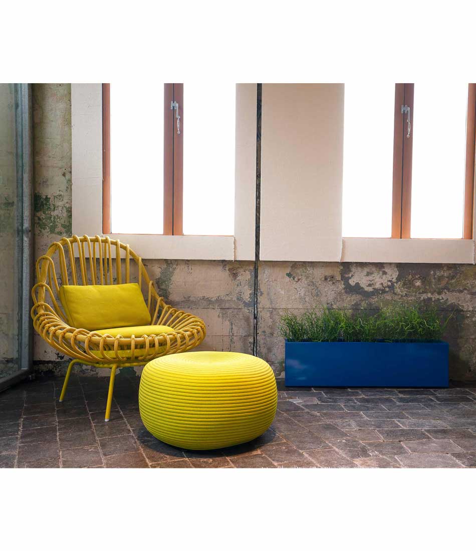 Layer All Day planter in royal blue gloss finish next to a chair and ottoman.