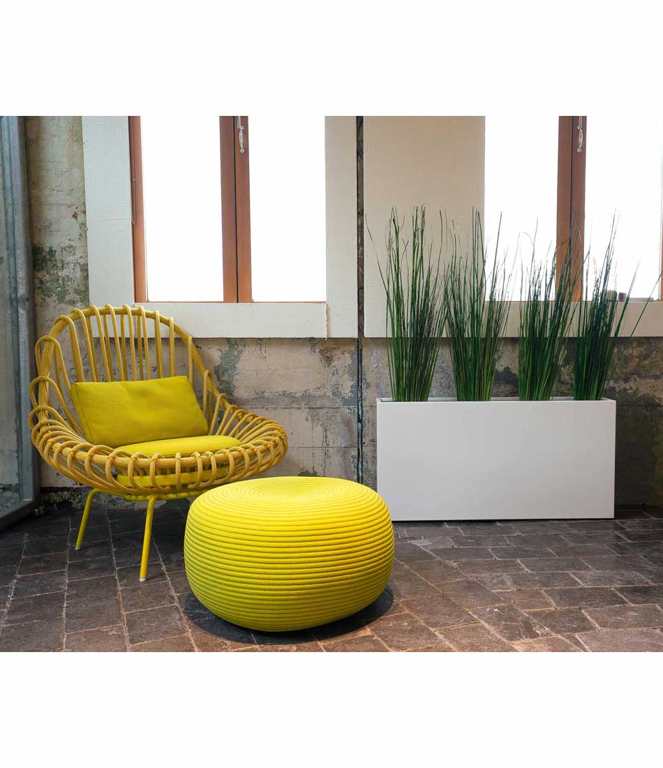 Layer Everyday aluminum planter in white gloss finish next to chair and ottoman.