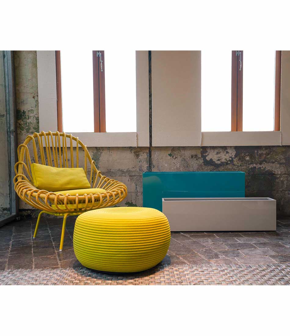 Layer All Day and Everyday planters side by side, next to a chair and ottoman.