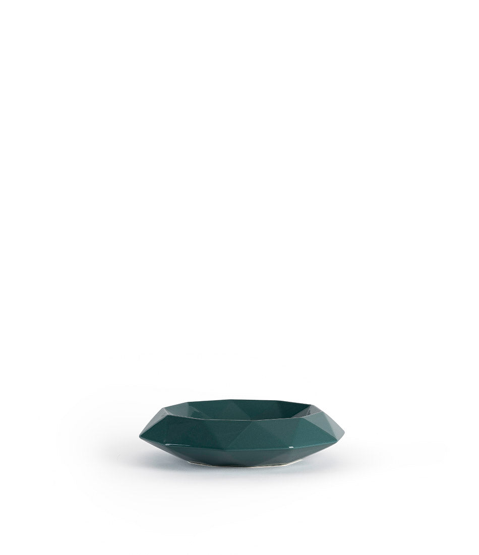 Small circular centrepiece in a glossy teal finish, textured with diamond shapes.