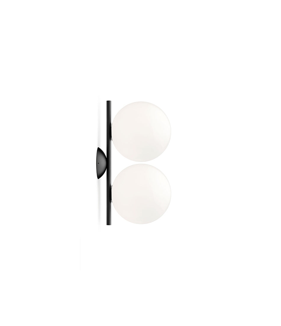Small Flos IC Lights Double Ceilng/Wall Sconce. Two opaque glass spherical diffusers mounted to vertical black bar.