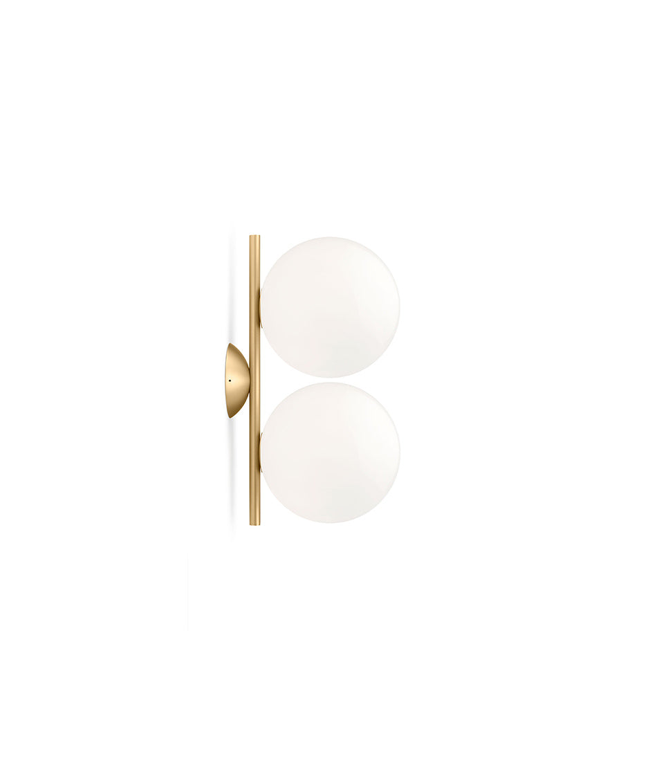 Small Flos IC Lights Double Ceilng/Wall Sconce. Two opaque glass spherical diffusers mounted to vertical brass bar.