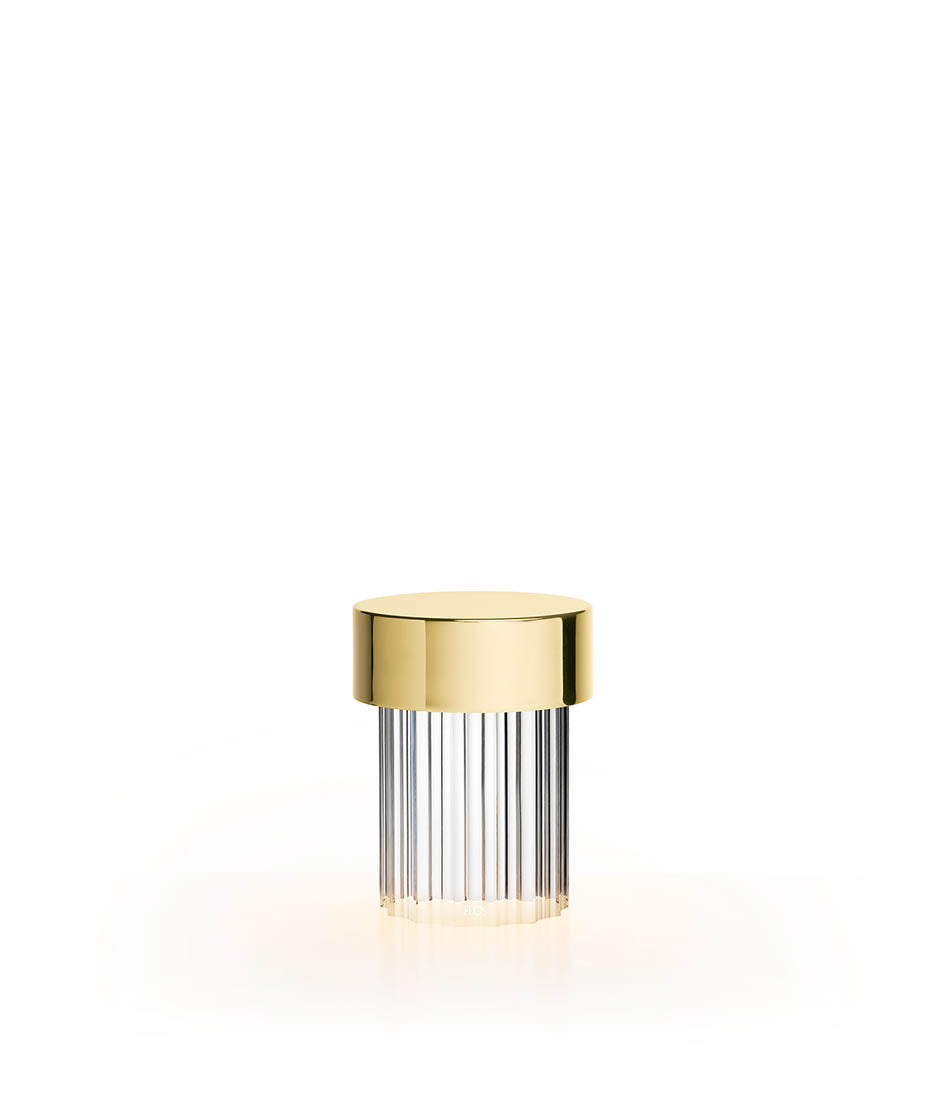 Flos Last Order table lamp in polished brass and fluted diffuser.