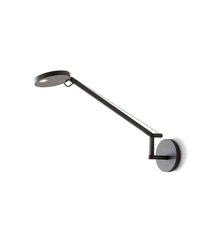 Artemide Demetra Micro Wall lamp in black mounted to a white surface.
