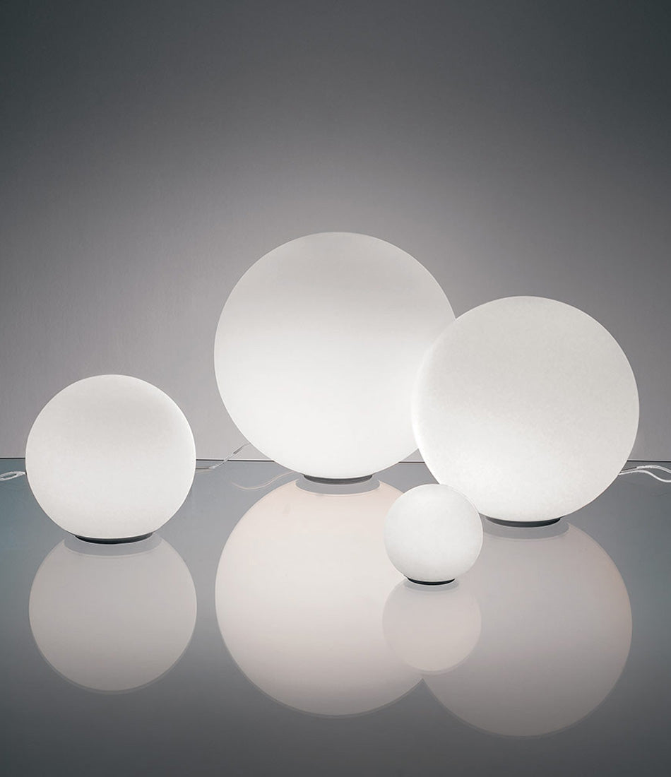 Artemide Dioscuri 14, 25, 35 and 42 grouped together on a glass surface.