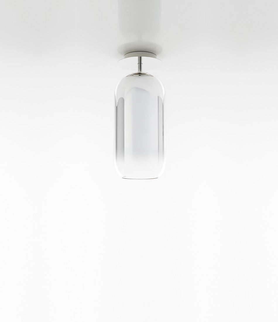 Artemide Gople Mini ceiling lamp, with pill-shaped blown glass shade in gradient silver.