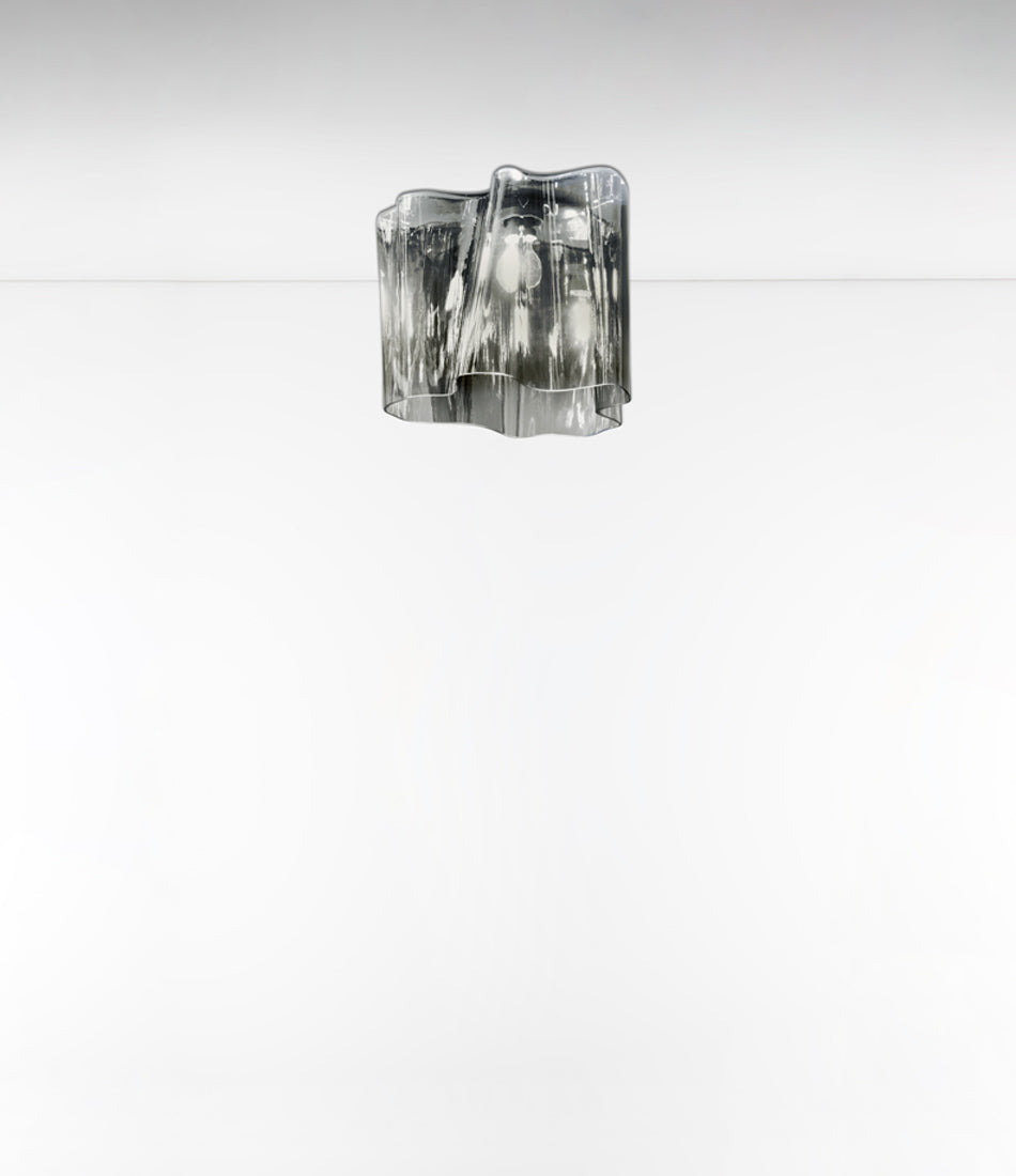 Artemide Logico ceiling lamp in grey smoke finish. Blown glass diffuser shaped into folded pattern.