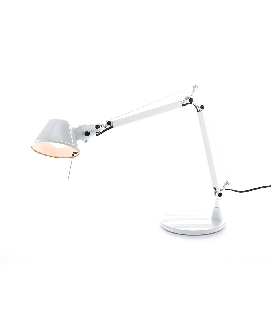 White Artemide Tolomeo table lamp, with double-jointed stem and small conical lamp head.