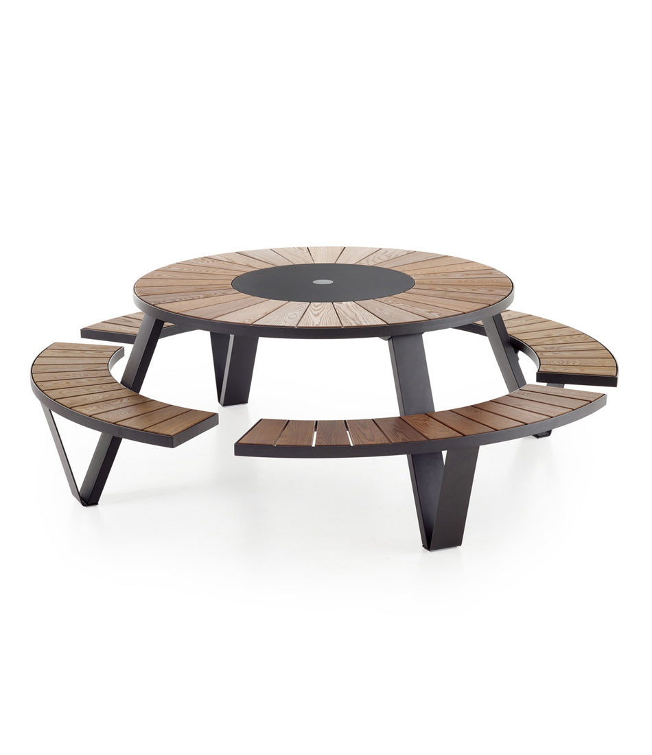 Black Extremis Pantagruel picnic table, with dark hellwood slats on circular bench and circular tabletop.
