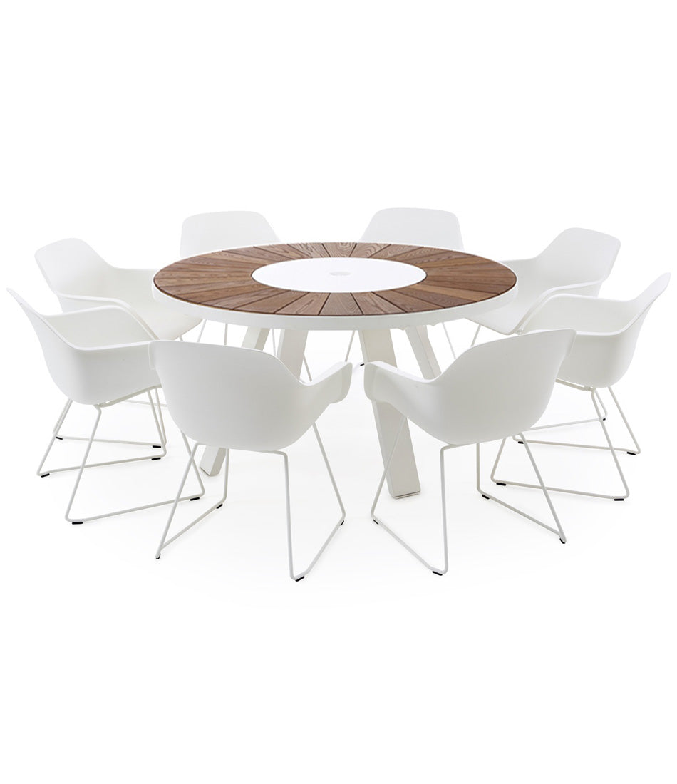 Extremis Pantagruel dining table surrounded by dining chairs.