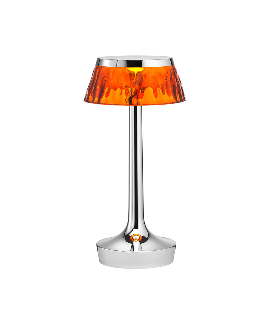 Flos Bon Jour Unplugged portable table lamp, with chrome stem and amber crown.