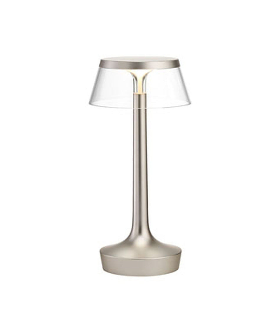 Flos Bon Jour Unplugged portable table lamp, with matte silver stem and transparent crown.