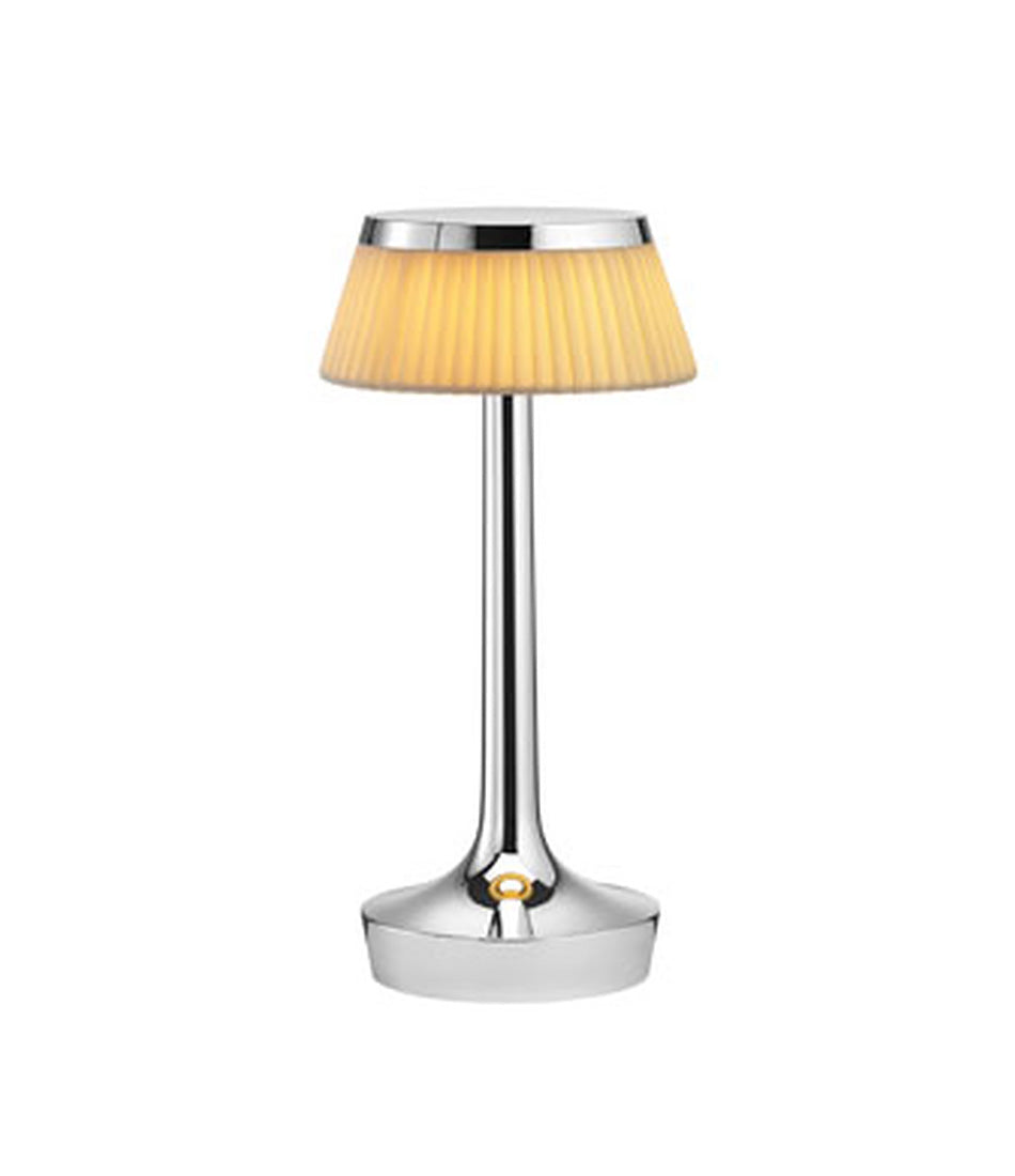 Flos Bon Jour Unplugged portable table lamp, with chrome stem and fabric crown.