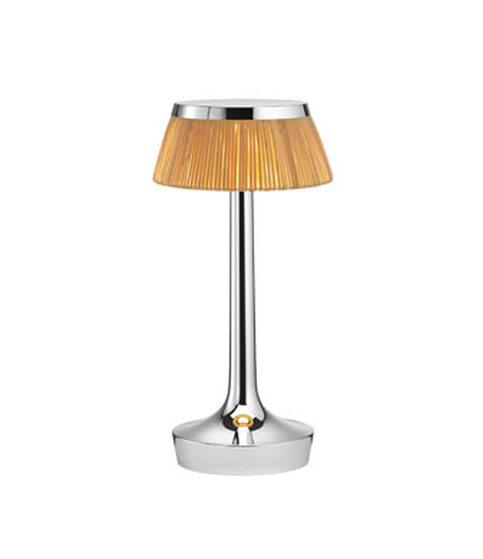 Flos Bon Jour Unplugged portable table lamp, with chrome stem and rattan crown.