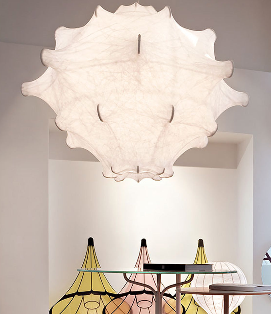 Flos Taraxacum 2 suspension lamp hanging over two small glass tables.